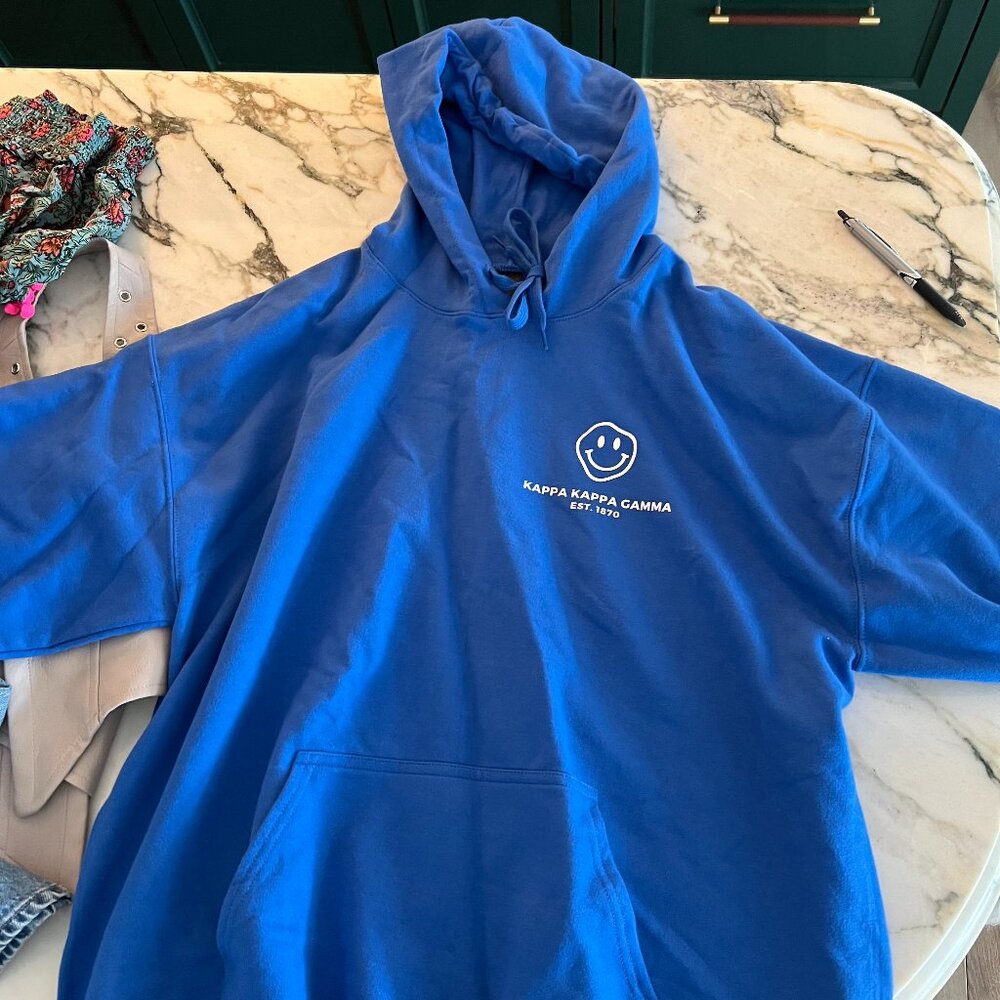 Cobalt Blue Kappa Kappa Gamma Hoodie with White Smiley Face on the back